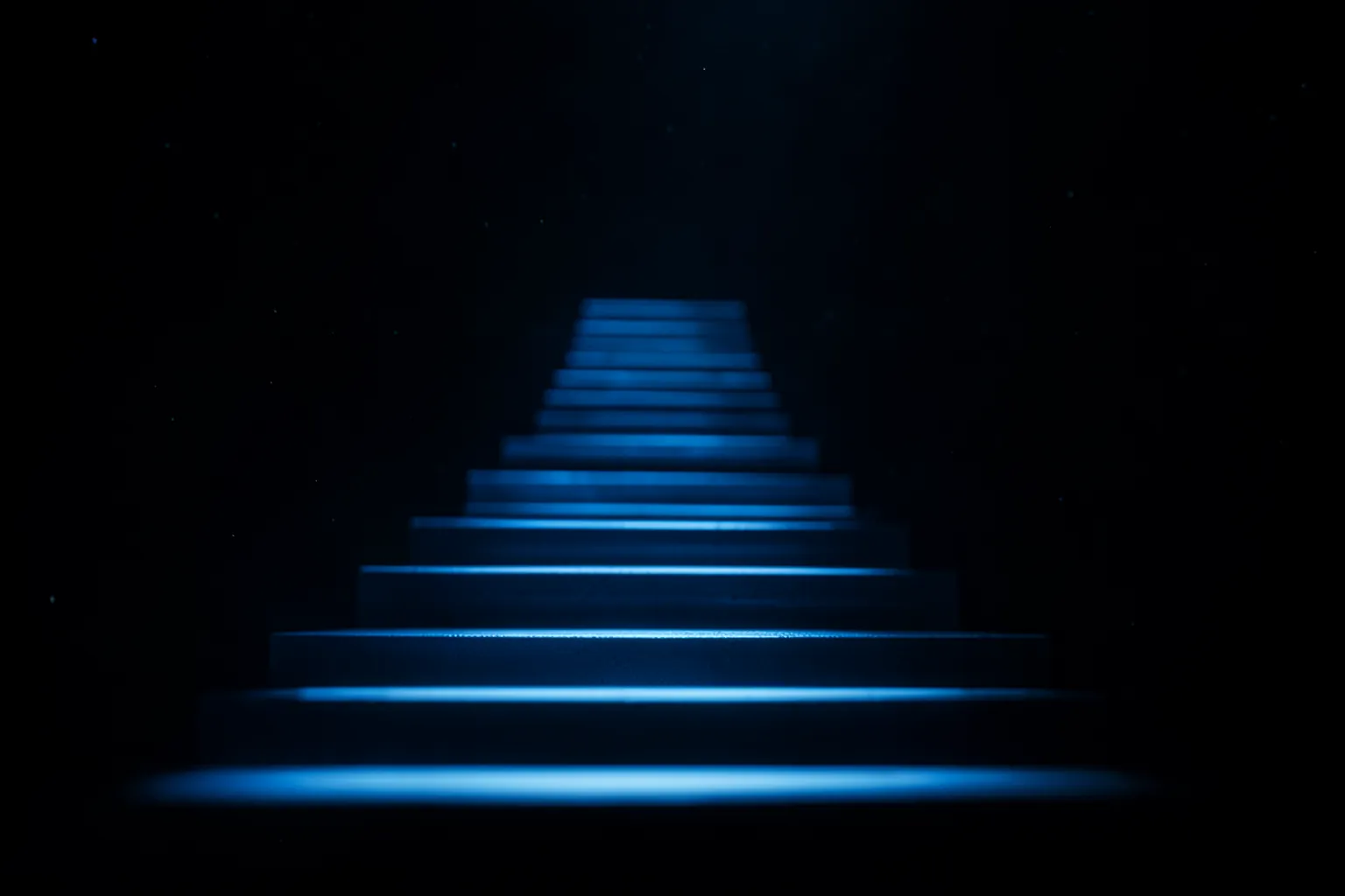 Escalones luminosos ascendentes en un espacio oscuro